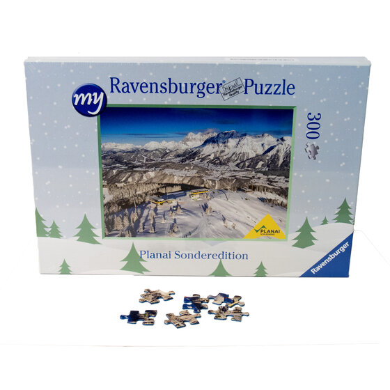 Puzzle box shows snowy Planai with gondola stations, yellow cabins, pine forest and mountain panorama | © Planai-Hochwurzen-Bahnen GmbH